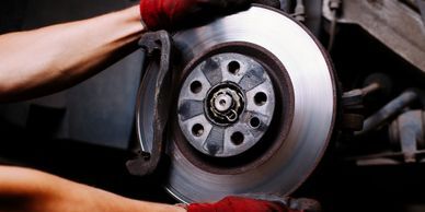 Man working on a car tire