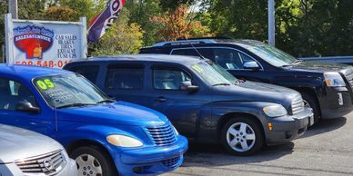 Four cars parked along a residential street